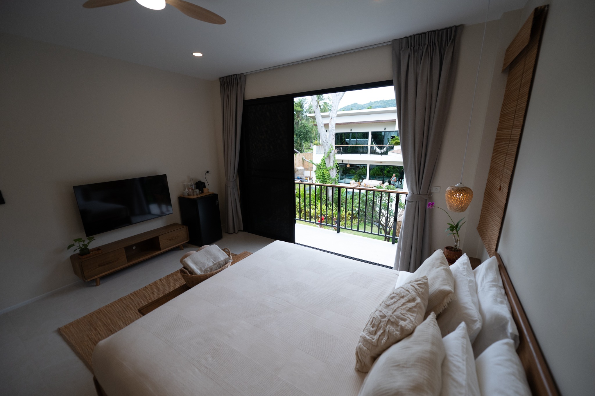 Upper-floor Junior Suite bedroom overlooking the garden