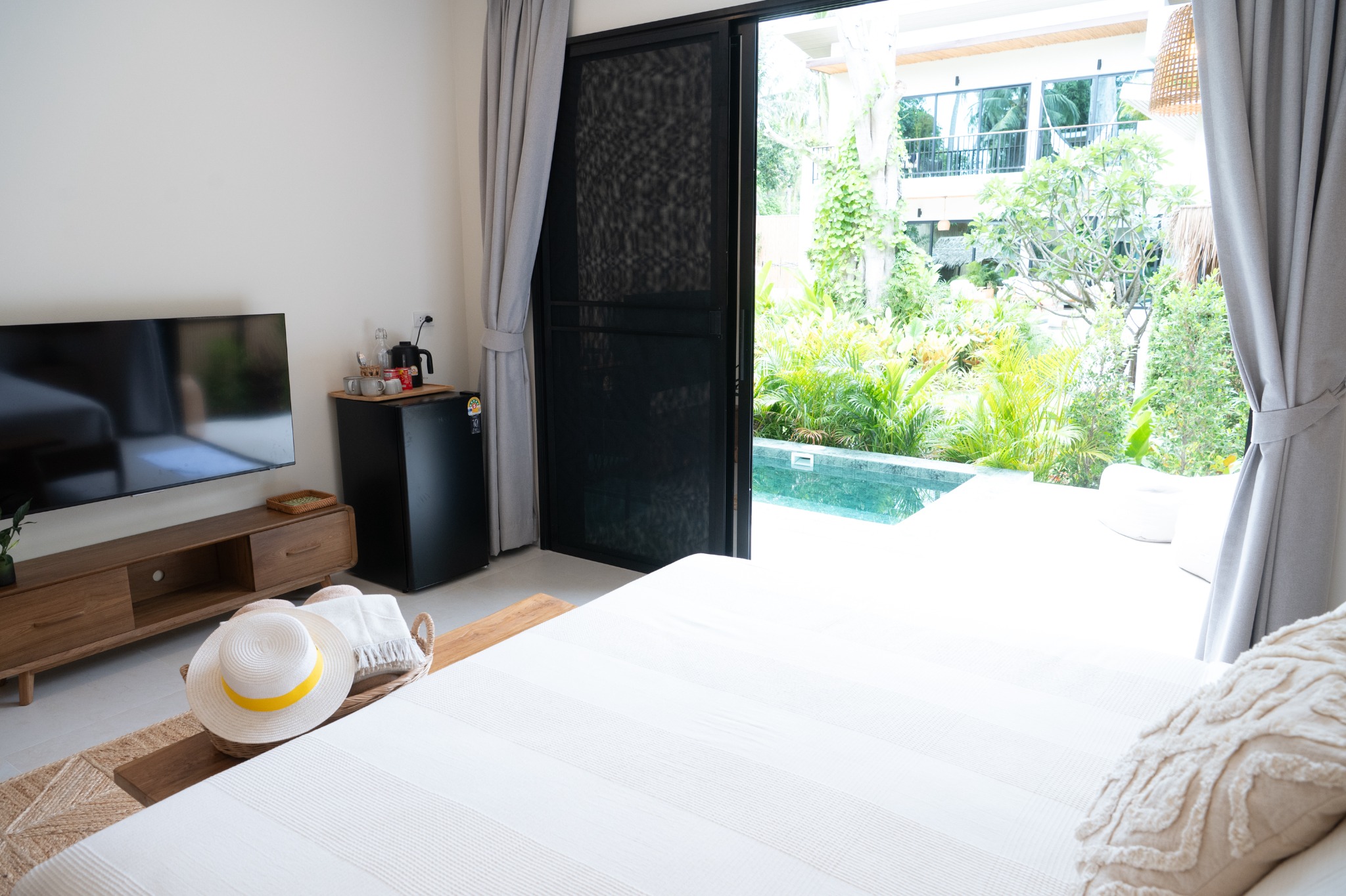 Pool Suite bedroom looking toward the shared plunge pool