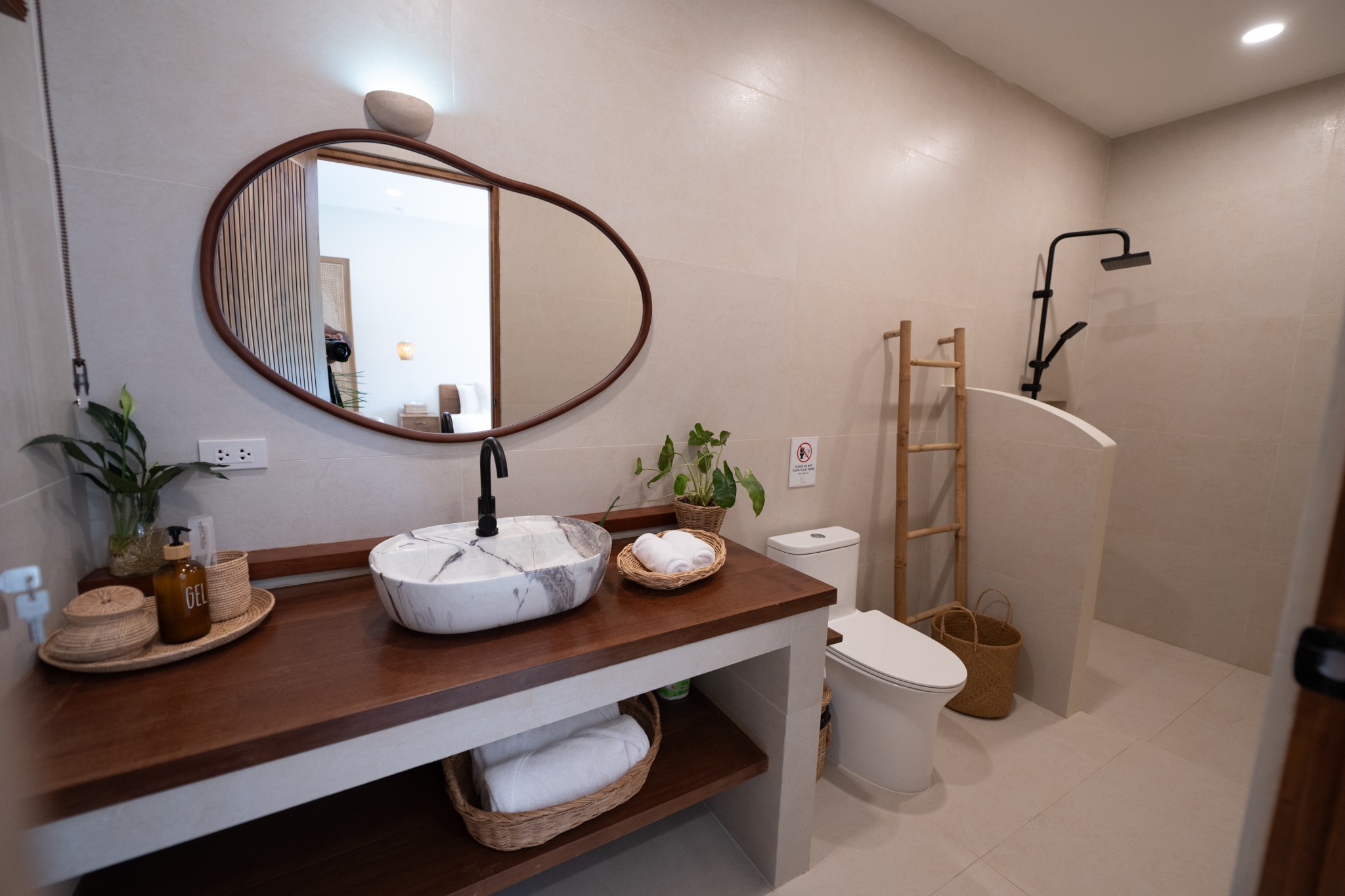 Junior Suite bathroom with white basins and walk-in shower